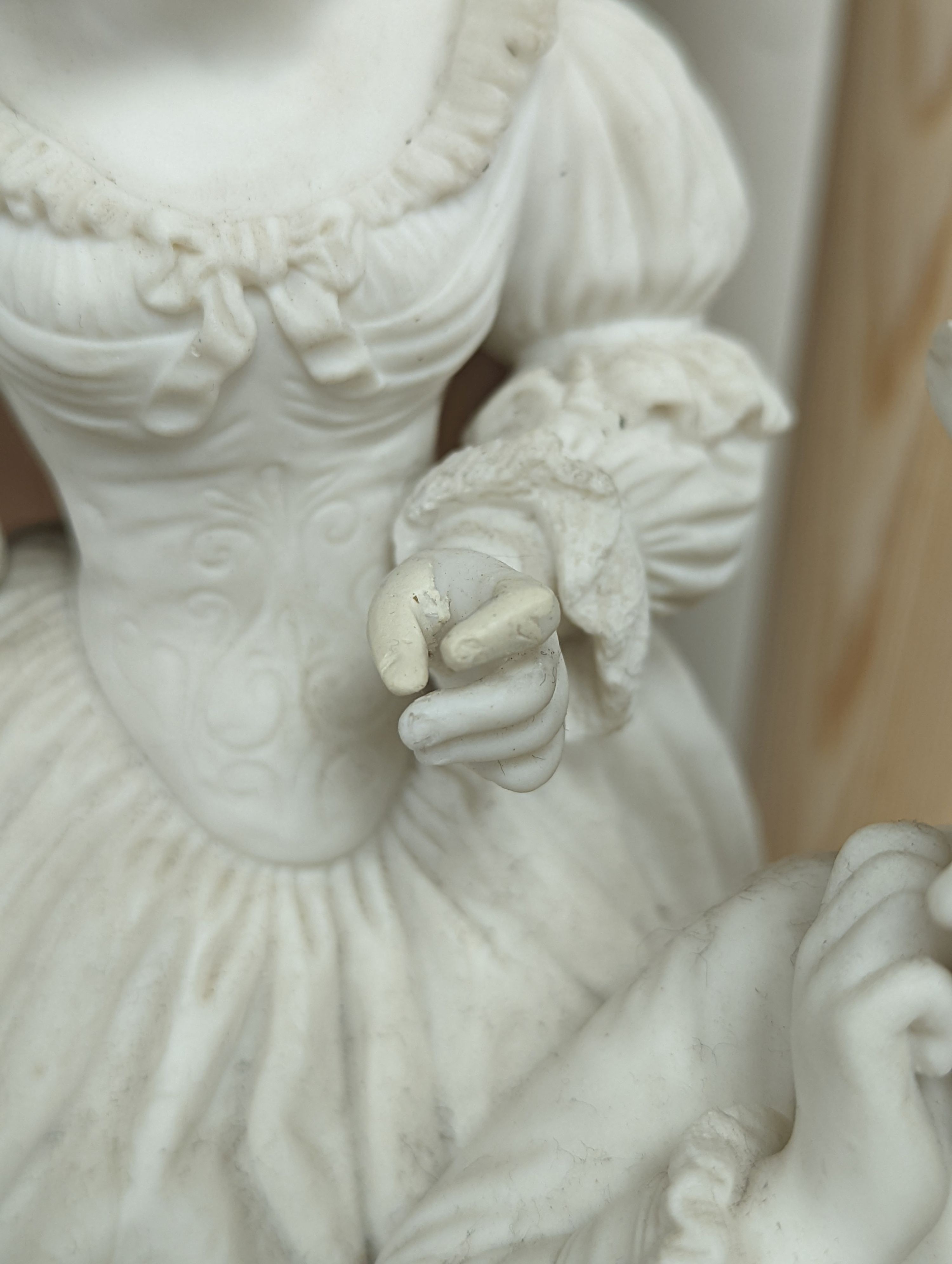 A 19th century Adams & Co. parian group of a man, woman, child and dog 31cm